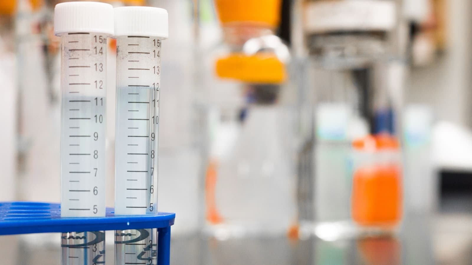 Graduated laboratory tubes containing different liquid volumes
